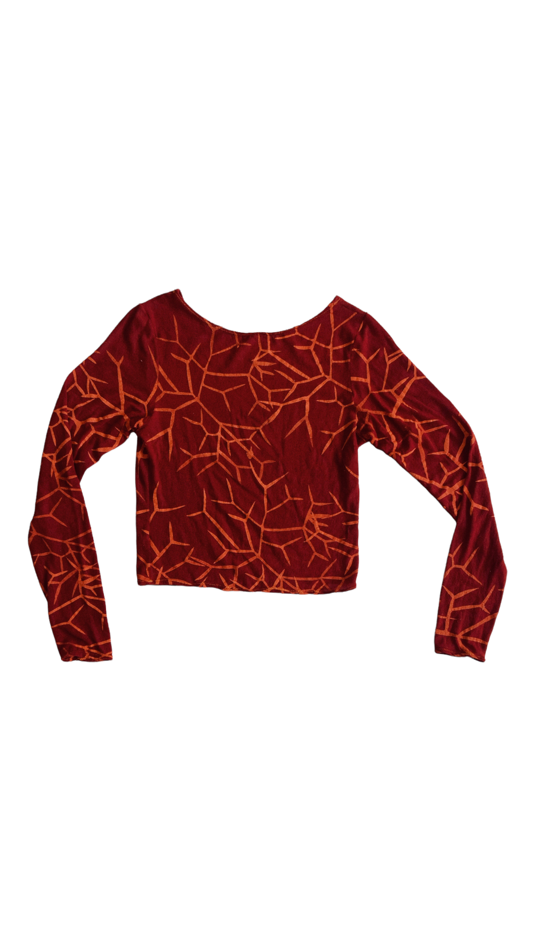 Product shot of the Mona Cordes long sleeve, red, printed, jersey top. The print has bright orange abstract lines that resemble tree roots.